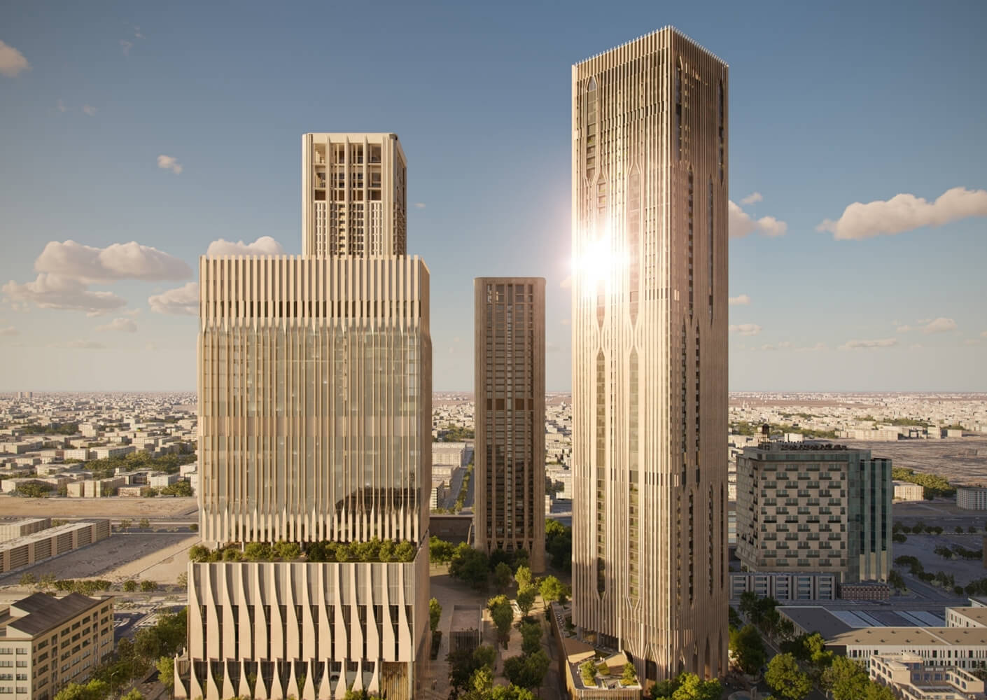 Tall skyscrapers under a sunny sky with cityscape in the background.