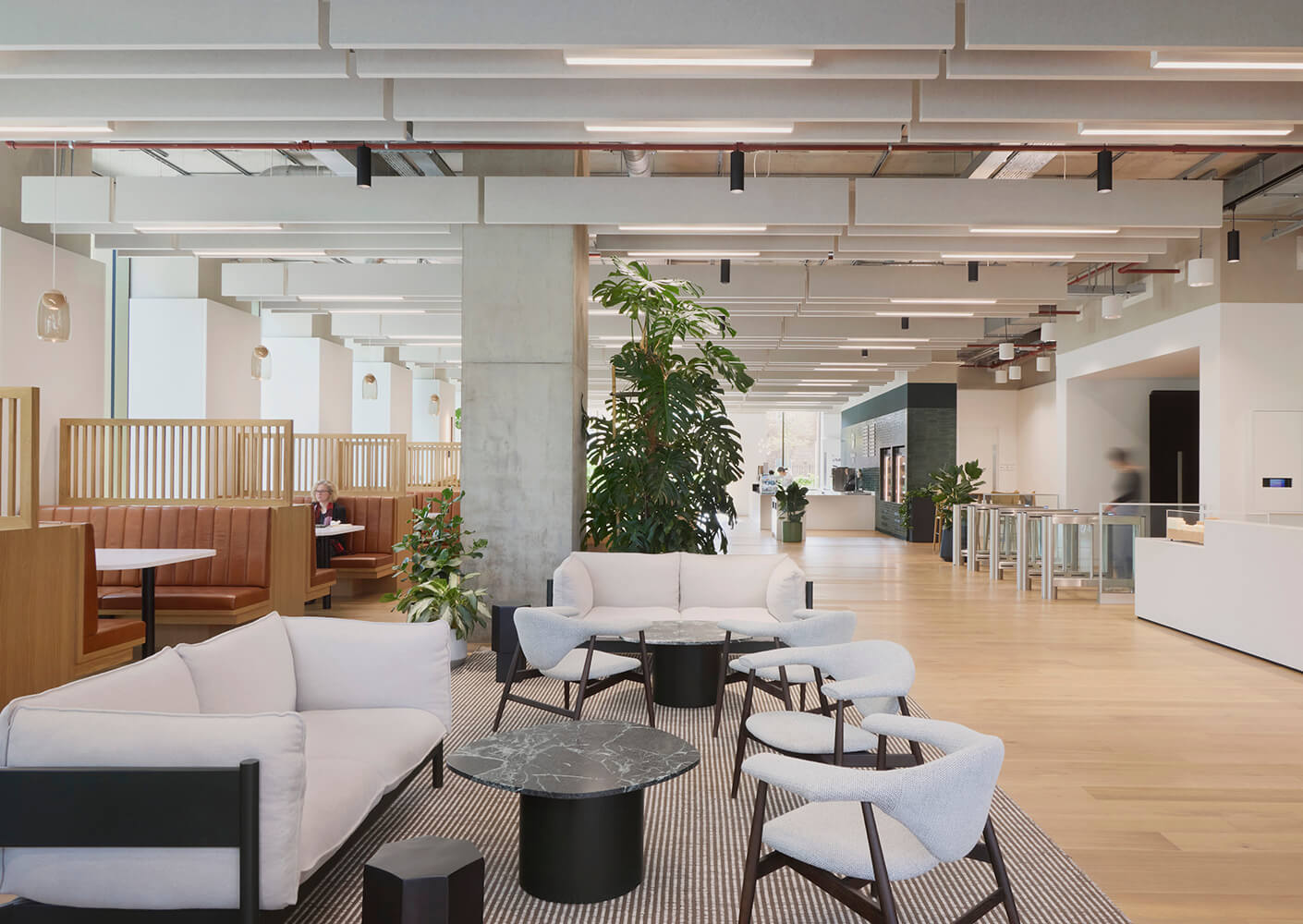 Modern open office space with cozy seating and natural light.