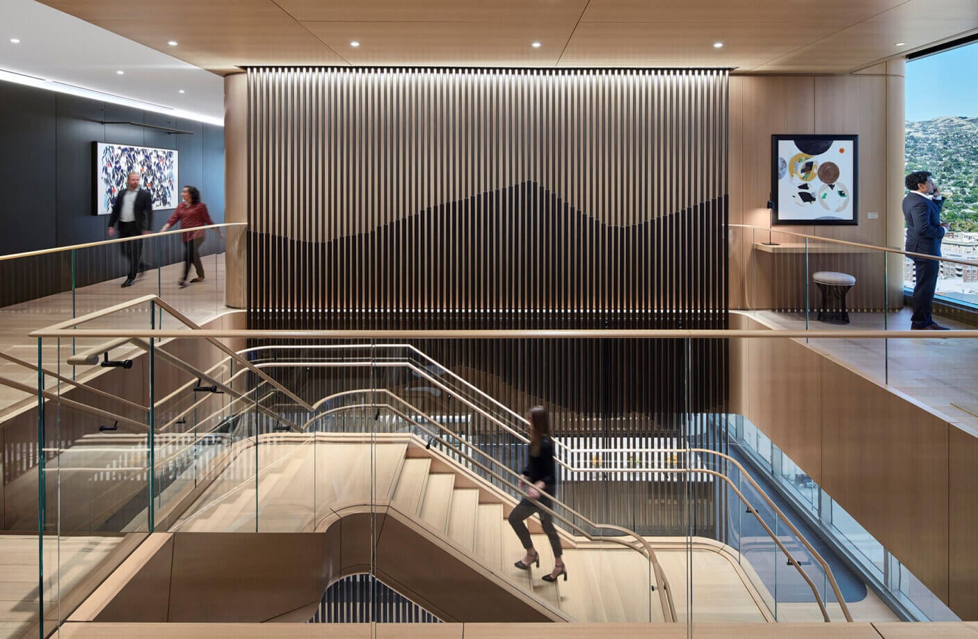 Modern office interior with elegant staircase and architectural design elements.