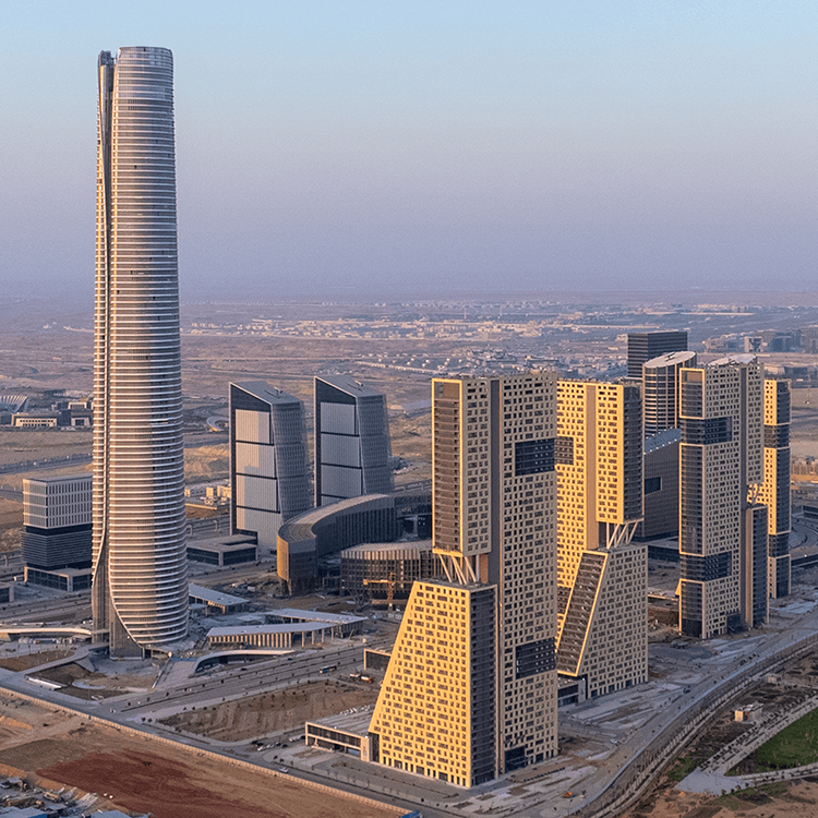 Modern skyscrapers in a cityscape at sunset, showcasing contemporary architecture.