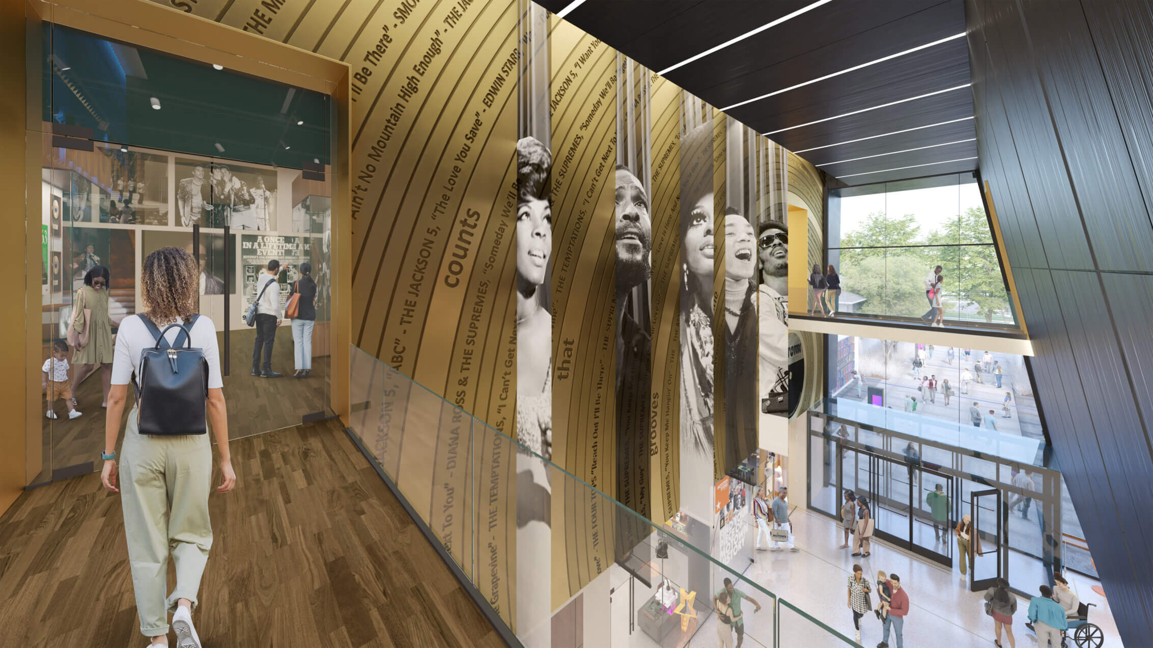 Visitor explores music history exhibit with iconic artist portraits and large windows.