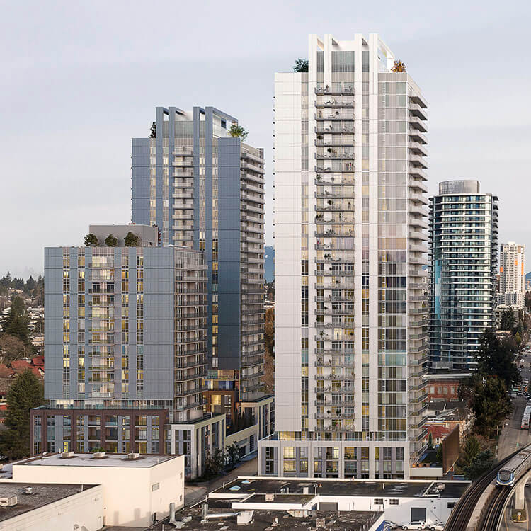 Modern high-rise buildings in an urban skyline setting, cloudy sky in the background.