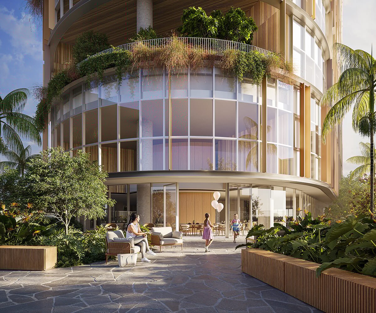 Modern hospital with garden patio and people enjoying outdoor seating.