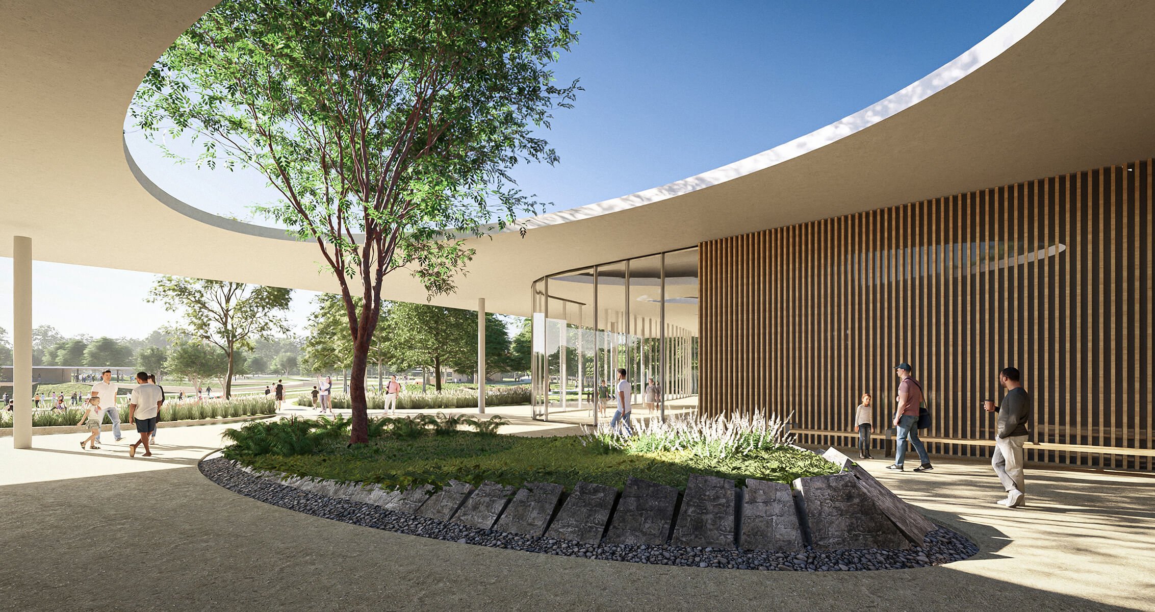 Modern architectural exterior with open courtyard, trees, and people enjoying the space.