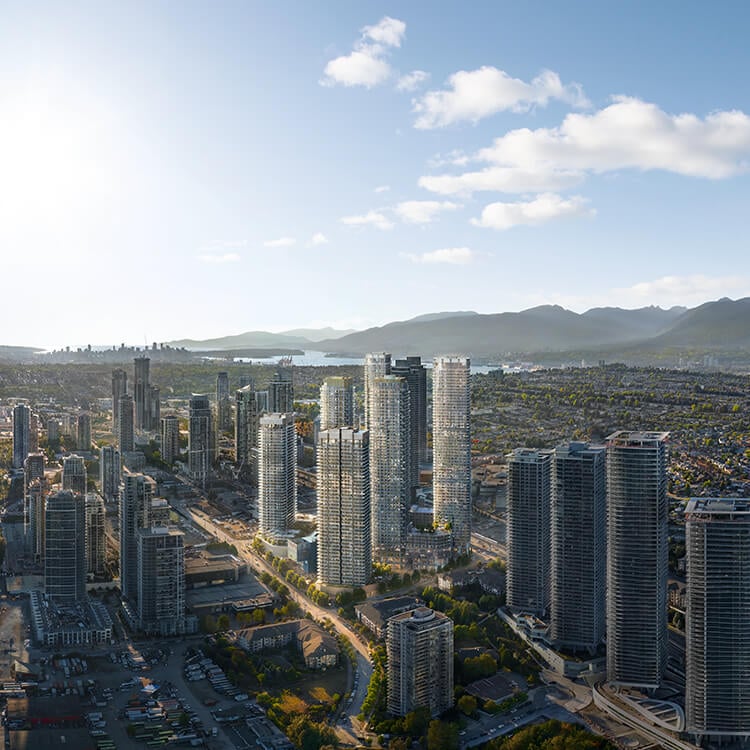 Aerial view of a city skyline with high-rise buildings under a clear sky.