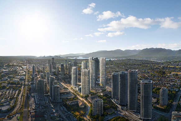 City skyline with tall skyscrapers under a sunny sky.