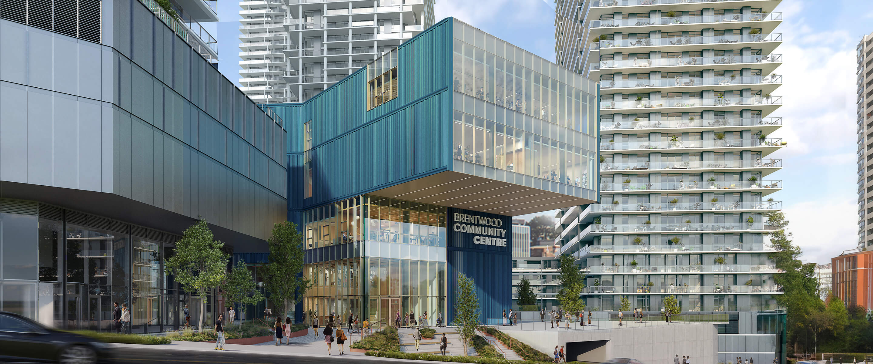 Modern Brentwood Community Centre with people outside, surrounded by tall buildings.