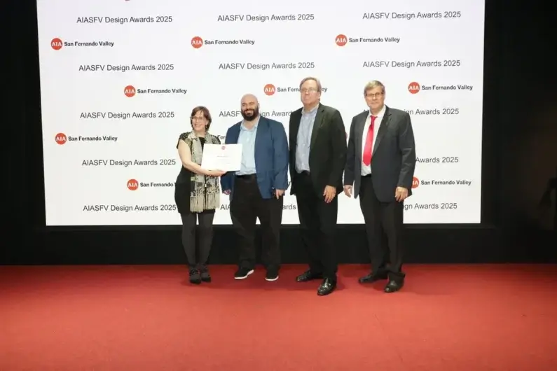Group at AIASFV Design Awards 2025 ceremony holding certificate on stage.