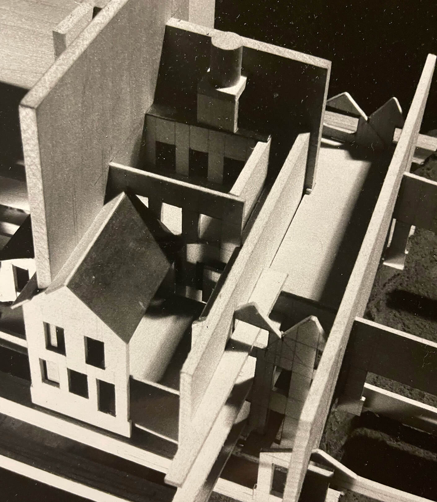 Architectural model showcasing a complex building design layout in monochrome.