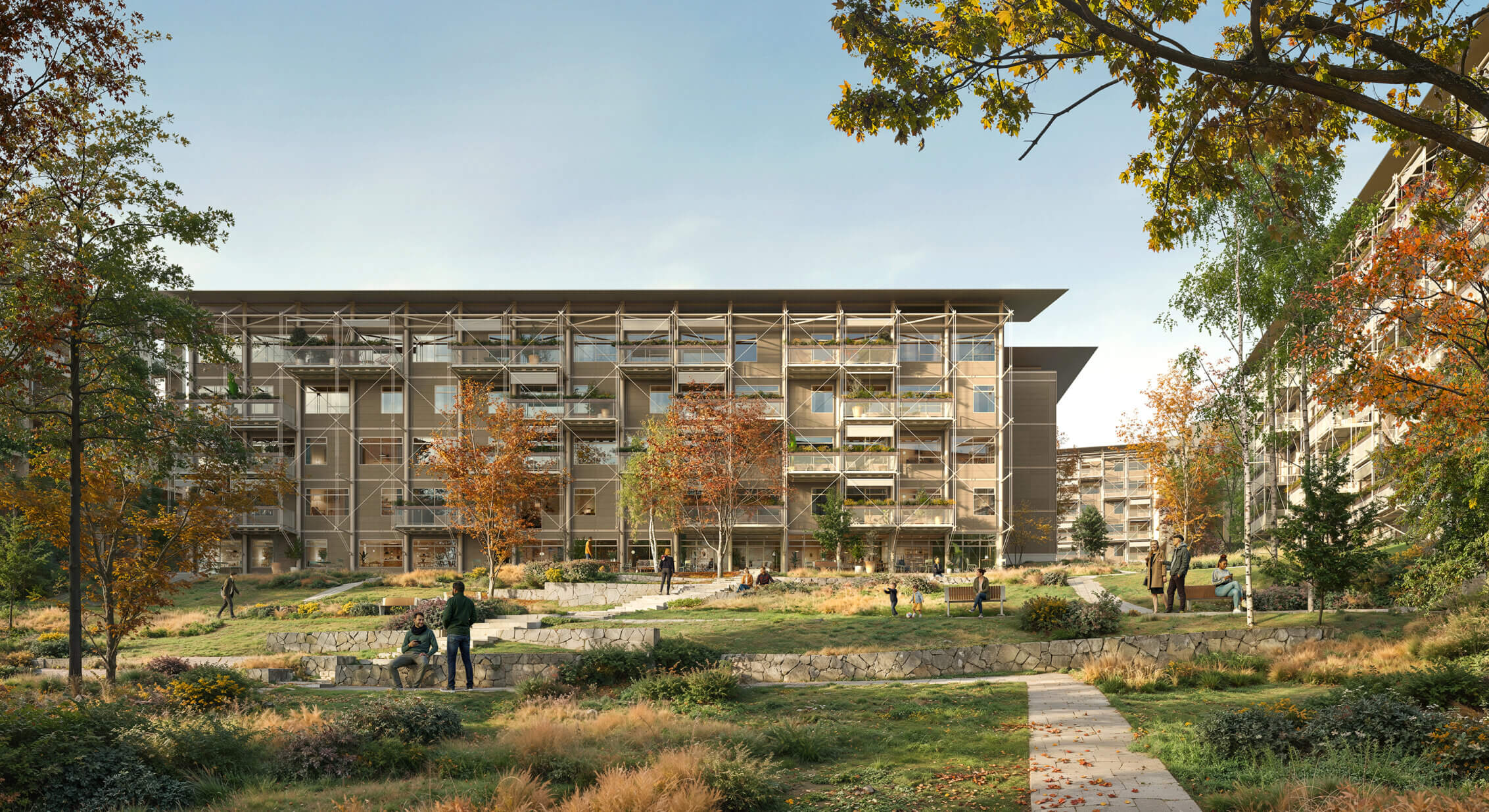 Modern residential complex with landscaped gardens and people enjoying outdoor space.