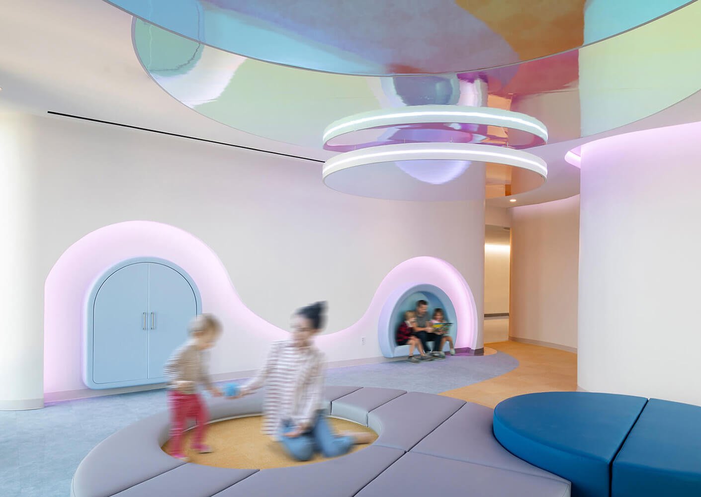 Bright and playful kids' activity space with colorful seating and interactive areas.