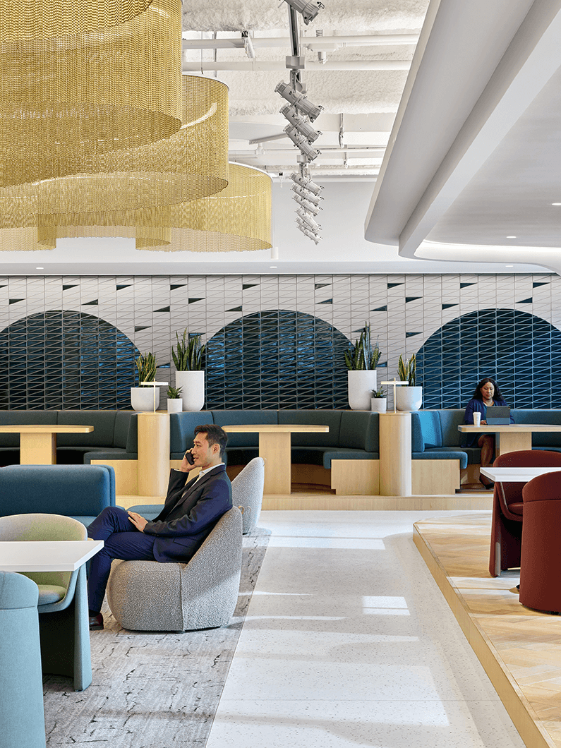 Warm cafe space with tiled walls and soft seating