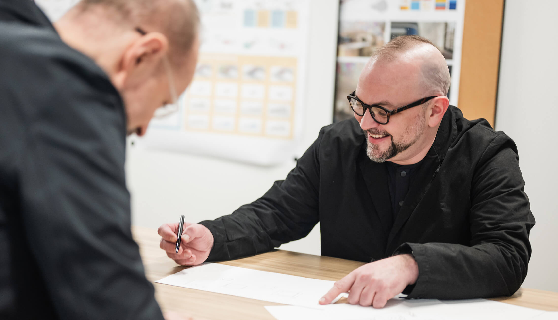 Chris Hardie and another designer collaborating at a desk.