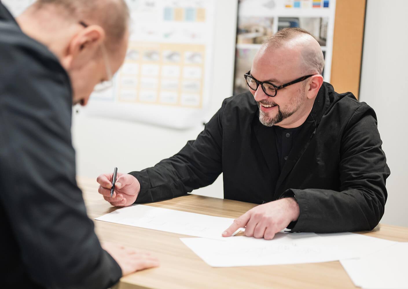 Chris Hardie and another designer collaborating at a desk