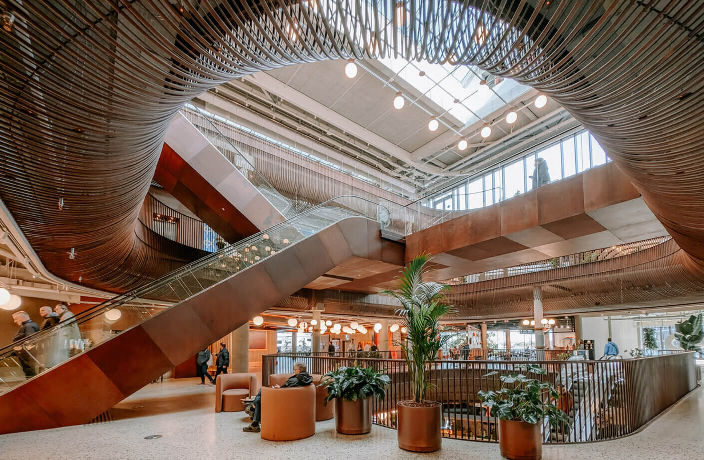 Modern atrium featuring metal accents and natural light.