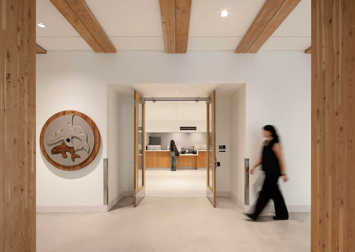 Interior daytime view showing Musqueam artwork in the UBC MacIsaac Health Building