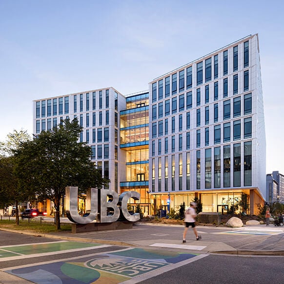 Exterior view at dusk of UBC MacIsaac Health Building
