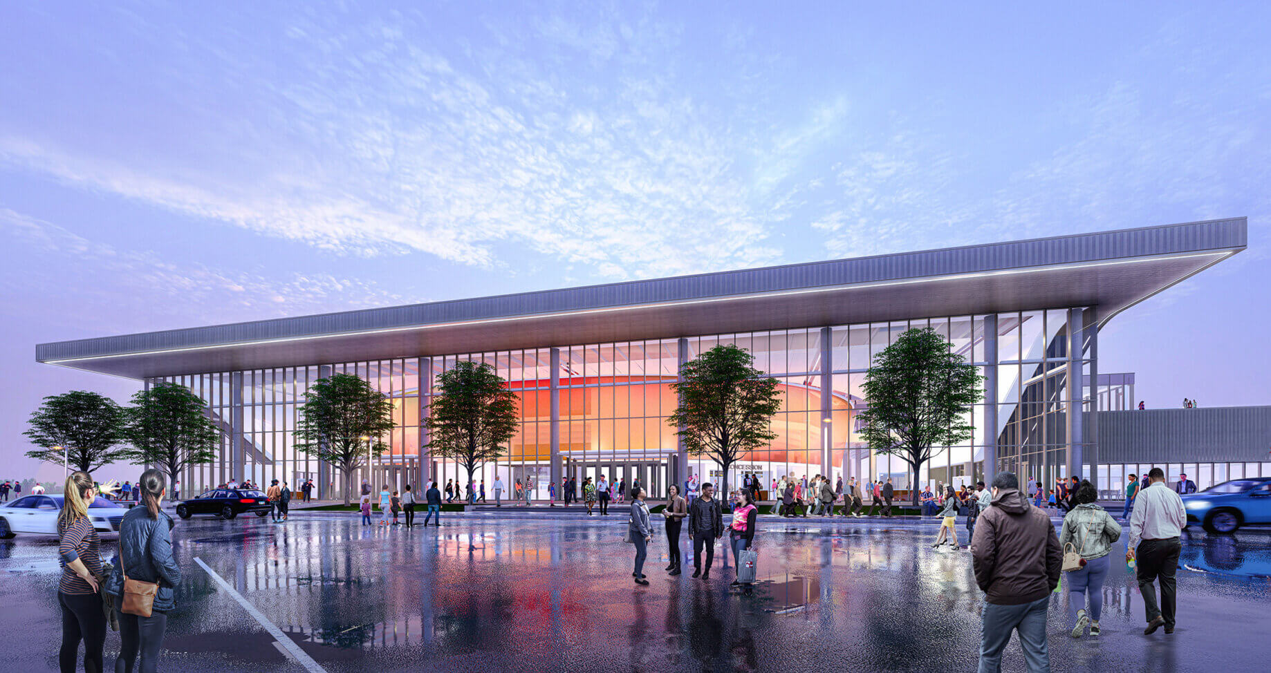 New public building with large glass facade, surrounded by people and trees, in an urban environment at dusk. Wet pavement reflects the structure.