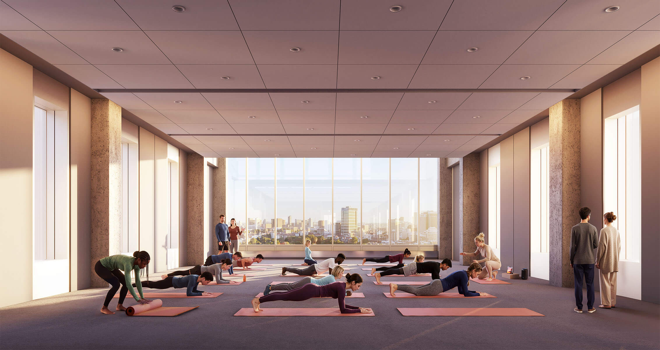 Group of people participating in a yoga class, with some practicing poses on mats and others observing in a well-lit studio.