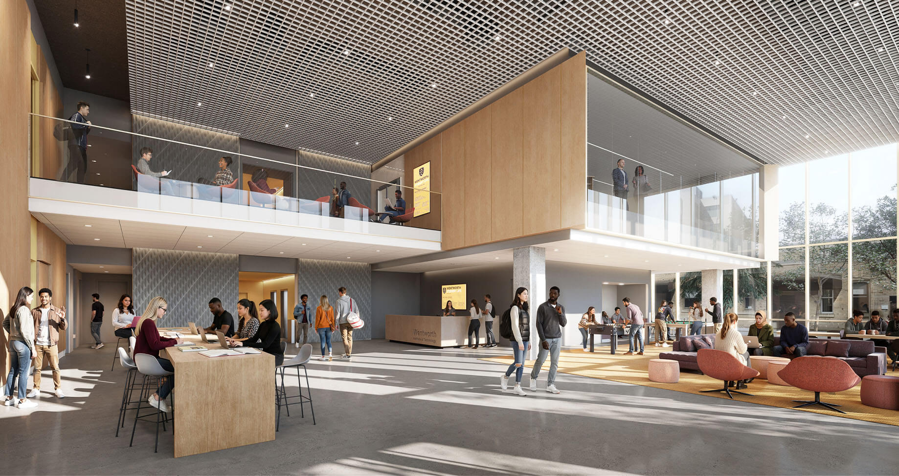 Interior of a lively university space with students engaging in work, study areas, and a reception desk, featuring large windows and communal seating.