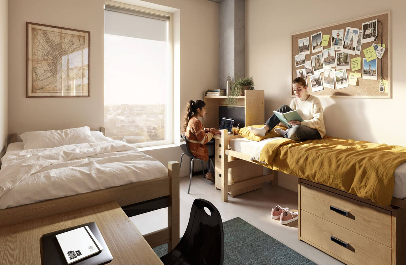 Two students in a shared dorm room, one studying on a bed and the other using a laptop at a desk, with natural light from a window.