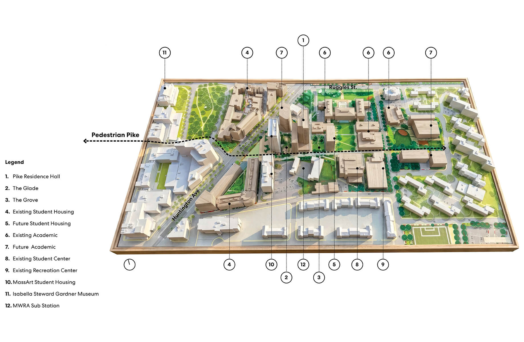 Aerial rendering of a campus layout featuring buildings, green spaces, and pathways, labeled with various key locations and their functions.